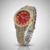 Reloj de acero y dorado con esfera roja y cristales
