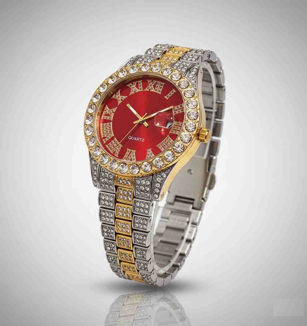 Reloj de acero y dorado con esfera roja y cristales